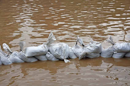 wall of sandbags to fend off raging river
