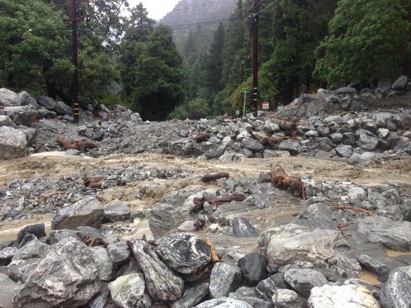 Forest Falls - 2 lane road under flood debris. Photo: San Bernardino County Fire Dept