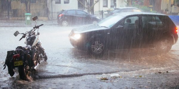 Water sweeps down a street in Sydney, Australia, during a torrential downpour. Image: Murray via Flickr, under CC BY-NC-ND 2.0